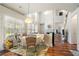 Breakfast nook features hardwood floors, high ceiling and view to fireplace in living room at 3616 Myrtlewood Nw Ct, Kennesaw, GA 30144