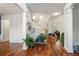Bright foyer with hardwood floors, white columns, and a staircase with natural light at 3616 Myrtlewood Nw Ct, Kennesaw, GA 30144