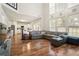 Open-concept living room with hardwood floors, large windows, and access to the kitchen at 3616 Myrtlewood Nw Ct, Kennesaw, GA 30144