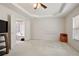 Spacious main bedroom features a tray ceiling and carpet at 3616 Myrtlewood Nw Ct, Kennesaw, GA 30144