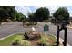 Gated entrance to Rexmill Square featuring lush green landscape and a private property sign at 636 North Ave # 11E, Jonesboro, GA 30236