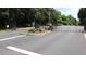 Gated entrance to Rexmill Square featuring lush green landscape and a private property sign at 636 North Ave # 11E, Jonesboro, GA 30236