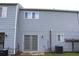 Light blue townhouse featuring sliding glass doors, tidy siding and installed air conditioning units at 636 North Ave # 11E, Jonesboro, GA 30236