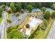Aerial view of the community pool, tennis courts, and playground, highlighting the fantastic neighborhood amenities at 115 Township Ct, Woodstock, GA 30189