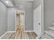 Hallway area features hard surface flooring, neutral paint, and easy access at 115 Township Ct, Woodstock, GA 30189