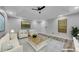 Living room featuring plush seating, stylish decor, and lots of light at 115 Township Ct, Woodstock, GA 30189