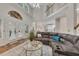 Expansive living room showcasing soaring ceilings, french doors, and a large sectional sofa at 115 Township Ct, Woodstock, GA 30189