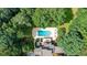 Aerial view of a private backyard featuring a pool and outdoor patio furniture at 1510 Chevron Dr, Sandy Springs, GA 30350