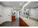 Elegant bathroom featuring dual sink vanities with granite countertops and modern fixtures at 1510 Chevron Dr, Sandy Springs, GA 30350