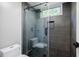 Stylish bathroom featuring a tiled shower with glass door and modern fixtures at 1510 Chevron Dr, Sandy Springs, GA 30350