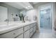Bright bathroom with double sink vanity, quartz countertop, and a glass-enclosed shower at 1510 Chevron Dr, Sandy Springs, GA 30350