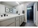 Modern bathroom with dual sinks, sleek countertops, and a glass-enclosed shower for a spa-like experience at 1510 Chevron Dr, Sandy Springs, GA 30350