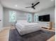 Serene bedroom featuring a large bed, modern furniture, and bright natural light at 1510 Chevron Dr, Sandy Springs, GA 30350