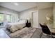 Serene bedroom with soft lighting, tile floors, and access to a sunroom and patio at 1510 Chevron Dr, Sandy Springs, GA 30350