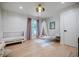 Stylish Bedroom with a patterned accent wall, plush chair, and a charming canopy at 1510 Chevron Dr, Sandy Springs, GA 30350
