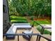 Relaxing deck with comfortable seating and views of the serene, wooded backyard at 1510 Chevron Dr, Sandy Springs, GA 30350