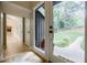 Inviting entryway with a view to the landscaped front yard and hallway at 1510 Chevron Dr, Sandy Springs, GA 30350