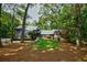 Charming home nestled among mature trees featuring a manicured front lawn and a welcoming entrance at 1510 Chevron Dr, Sandy Springs, GA 30350