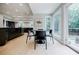 Bright eat-in kitchen featuring modern cabinetry, stainless steel appliances, and a table with backyard views at 1510 Chevron Dr, Sandy Springs, GA 30350