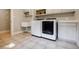 Well-equipped laundry room featuring built-in cabinets, shelving, and a modern washer and dryer at 1510 Chevron Dr, Sandy Springs, GA 30350