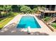 Backyard oasis featuring a large, in-ground swimming pool with diving board and a deck at 1510 Chevron Dr, Sandy Springs, GA 30350