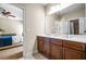 Elegant bathroom featuring a dual sink vanity and a view into the adjacent bedroom at 2953 Kings Walk Ave, Marietta, GA 30062