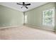 Spacious bedroom with a neutral color palette and ample natural light, perfect for relaxation and personalization at 2953 Kings Walk Ave, Marietta, GA 30062