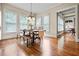 Elegant dining room with hardwood floors, chandelier, and large windows providing ample natural light at 2953 Kings Walk Ave, Marietta, GA 30062