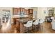 Open kitchen boasts large island with seating, stainless appliances and granite countertops at 2953 Kings Walk Ave, Marietta, GA 30062