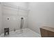 Functional laundry room features tile flooring and a wire shelf for efficient storage solutions at 2953 Kings Walk Ave, Marietta, GA 30062