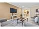 Comfortable living room with sofas, a flat-screen TV, and stylish decor in neutral colors at 2953 Kings Walk Ave, Marietta, GA 30062