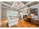 Inviting living room features coffered ceiling, fireplace, and hardwood floors with comfortable seating at 2953 Kings Walk Ave, Marietta, GA 30062