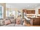 Inviting living area flowing into a modern kitchen with a breakfast bar and stainless steel appliances at 2953 Kings Walk Ave, Marietta, GA 30062