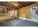 Unfinished basement with exposed wood beams, concrete floors, and framed walls ready for customization at 387 Hillside Sw Dr, Atlanta, GA 30310
