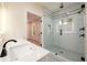 Stylish bathroom featuring a glass-enclosed shower with white subway tile and black fixtures at 387 Hillside Sw Dr, Atlanta, GA 30310