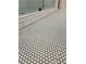 Close-up of bathroom floor featuring small, white, round tiling and black grout at 387 Hillside Sw Dr, Atlanta, GA 30310