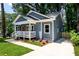 Charming exterior showcasing the front porch, landscaped yard, and freshly painted facade at 387 Hillside Sw Dr, Atlanta, GA 30310