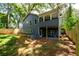 View of backyard, deck, covered porch and fenced in yard on blue home at 387 Hillside Sw Dr, Atlanta, GA 30310