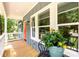 Charming porch view, featuring outdoor seating, bright windows, and a welcoming atmosphere with a potted plant at 387 Hillside Sw Dr, Atlanta, GA 30310