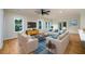 Bright living room with hardwood floors, modern furniture, and large windows offers a welcoming space at 387 Hillside Sw Dr, Atlanta, GA 30310