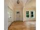 Bright living room featuring hardwood floors, neutral walls, stylish lighting, and access to the dining area at 387 Hillside Sw Dr, Atlanta, GA 30310