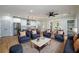 Open-concept living room and kitchen area filled with neutral tones and modern fixtures for a cozy feel at 387 Hillside Sw Dr, Atlanta, GA 30310