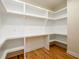 Spacious walk-in pantry with custom built-in shelving offering ample storage and organization solutions at 387 Hillside Sw Dr, Atlanta, GA 30310
