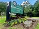 View of Emma Millican Park sign surrounded by flower beds and stone at 387 Hillside Sw Dr, Atlanta, GA 30310