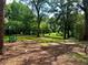 Green park view featuring a swing set and shade trees, offering an outdoor relaxing space at 387 Hillside Sw Dr, Atlanta, GA 30310