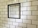 A shower niche provides convenient storage and adds a decorative touch to this modern bathroom at 387 Hillside Sw Dr, Atlanta, GA 30310