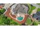 Aerial view of backyard featuring in-ground pool, hot tub and patio area with outdoor seating at 5009 Kingsley Manor Ct, Marietta, GA 30066