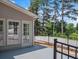 Covered patio with ceiling and doorway to a lush backyard at 5009 Kingsley Manor Ct, Marietta, GA 30066