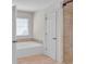 Bathroom featuring separate shower, tub and tile flooring at 5009 Kingsley Manor Ct, Marietta, GA 30066