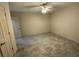 This is a cozy bedroom with gray tile flooring and a ceiling fan at 5009 Kingsley Manor Ct, Marietta, GA 30066